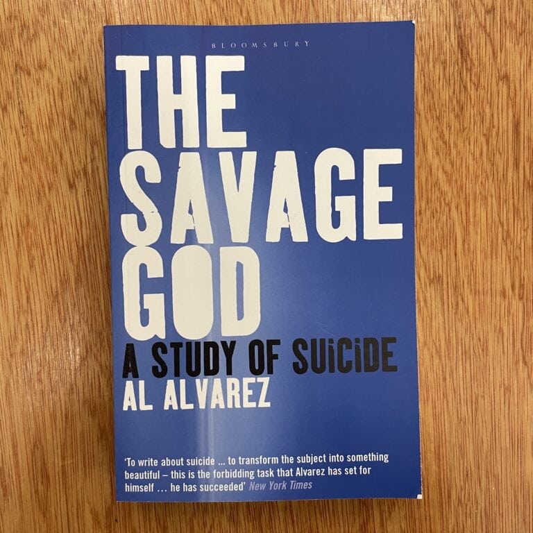Cover of 'The Savage God: A Study of Suicide' by Al Alvarez, featuring a blue background with bold white and black text.